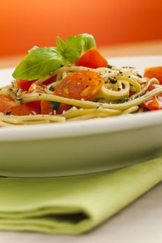 Spaghetti with cherry tomatoes on the table