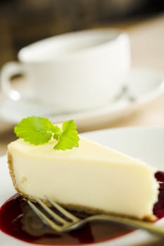 Cheese cake on the plate with coffee cup