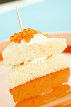 Salmon roe on the bread slice with sour cream