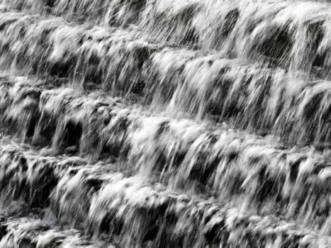 Water flowing down a terraced wall in Chadwick Lakes in Malta