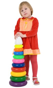 Little girl with plastic toy pyramid on white