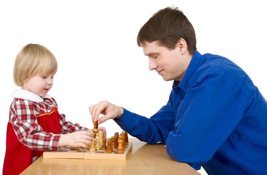 Man and child play chess on white 