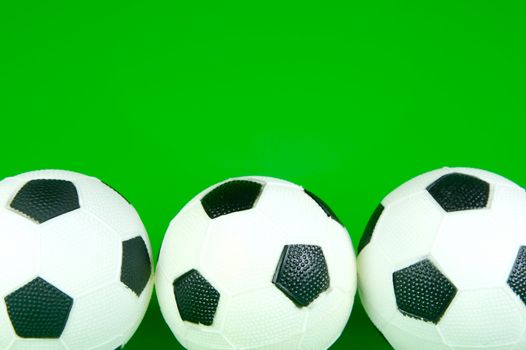 A soccor ball isolated against a green background