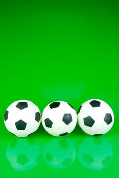 A soccor ball isolated against a green background