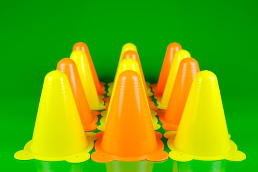 Witches hats isolated against a green background