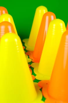 Witches hats isolated against a green background