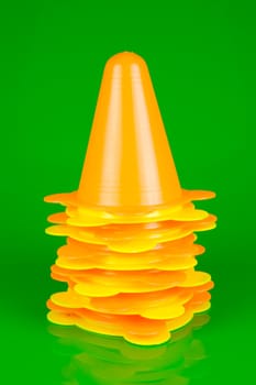 Witches hats isolated against a green background