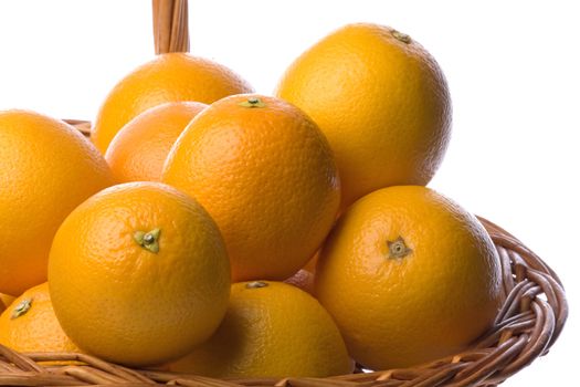 Isolated image of oranges in a basket against a completely white background.