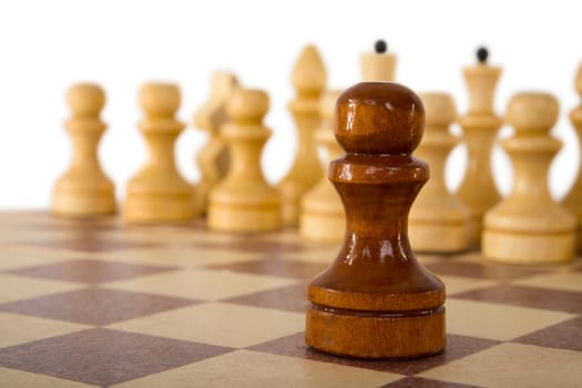 Foreground chess pawn  on a white background