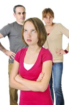 Teenage girl rolling her eyes in front of angry parents