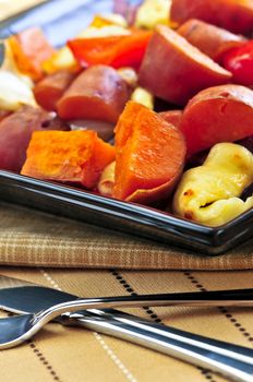 Vegetarian dish of roasted yams with cheese and peppers