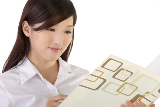 Business woman reading paper, closeup portrait of oriental office lady on white background.