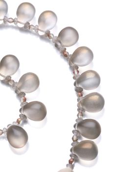 Fragment of the luxurious necklace, translucent beads to look like dripped