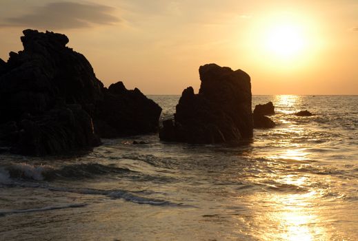 Silhouette of monument during sunset over the beach of Puerto Escondido