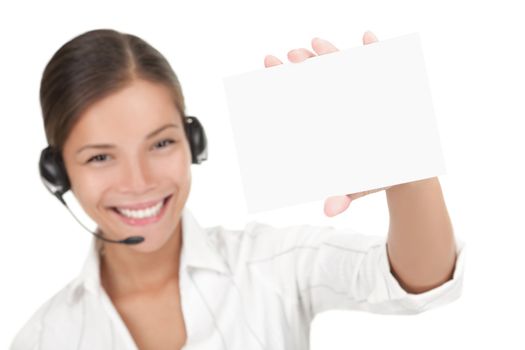 Customer service representative with headset holding a blank empty card. Isolated on white background.