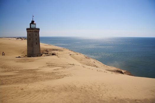 Lighthouse in the sand dunes of Rubjerg Knude in Denmark