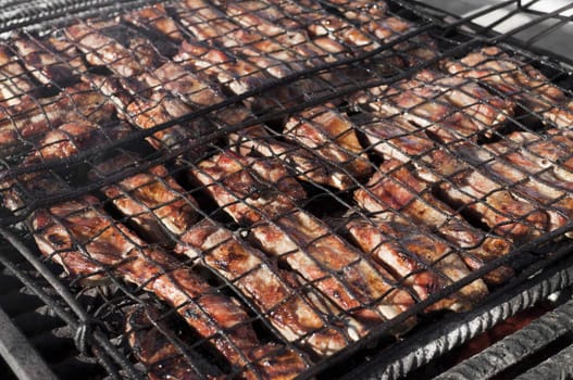 Meat pork on a italian festival barbecue grill