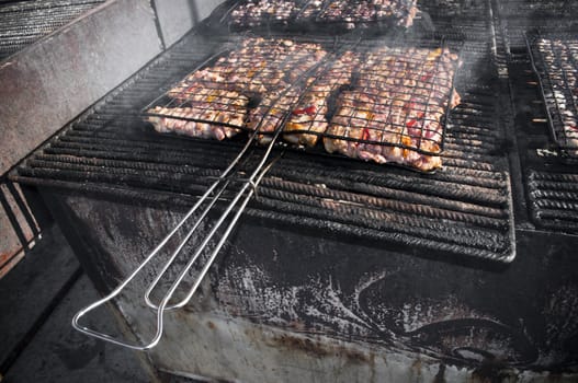Meat pork on a italian festival barbecue grill