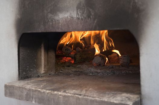 Italian traditional pizza  wood oven on fire