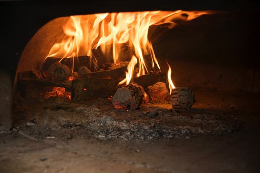 Italian traditional pizza  wood oven , fire detail