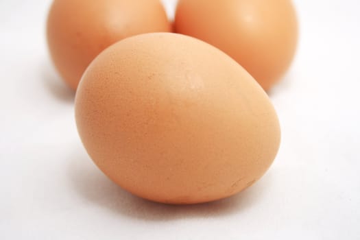 Three eggs on white background.