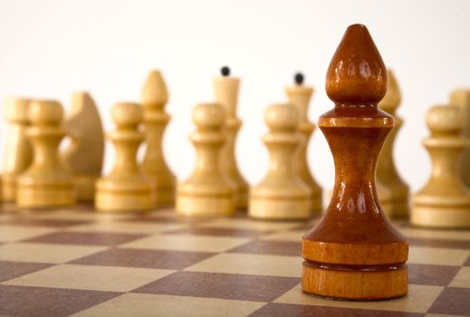 Brown chess bishop on a white background