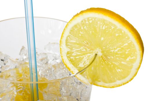 glass of orange juice with lemon slice and straw