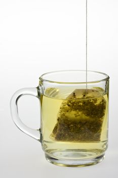 glass of herbal tea isolated on white