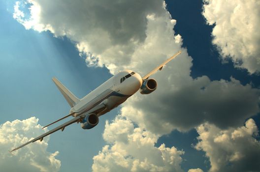 Passenger airplane on background with dark sunset sky and clouds