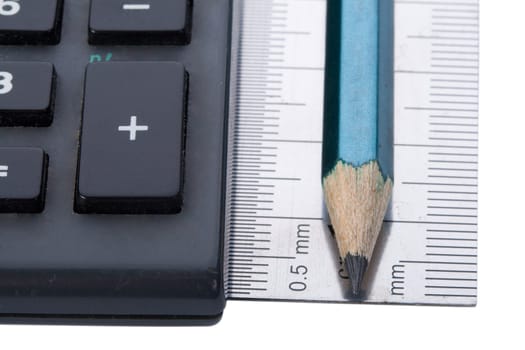 close-up calculator and ruler and pencil