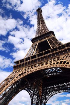 Eiffel tower on background of blue sky in Paris, France