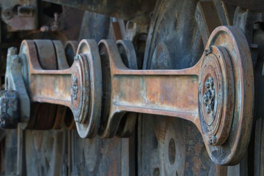 Close up of old rusted large train engine Train Coupling Rods