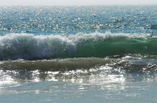 Rolling wave in morning light in Puerto Escondido, Mexico