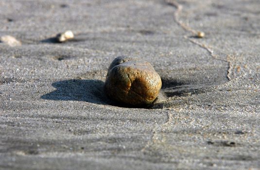 Stone in the sand on Beach in Puerto Escondido, Mexico