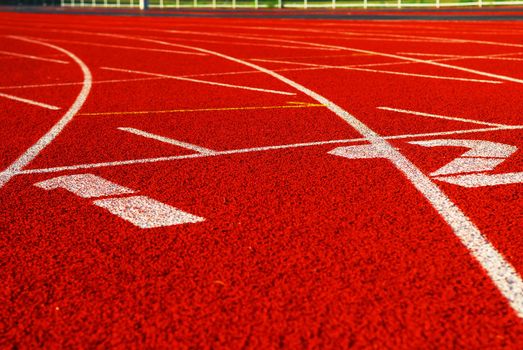 Curving lanes of a red racetrack with numbers 