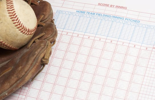 a picture of a ball and glove on a scorebook