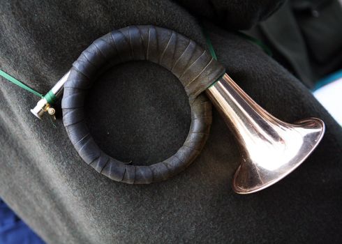 Hunting horn with leather enclosure an green band