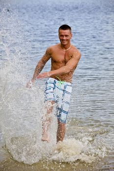 Handsome Young Man Having Fun In Water