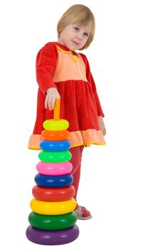 Little girl with plastic toy pyramid on white