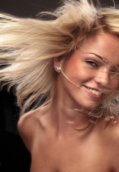 Beautiful Blond Woman Fluttering Her Gorgeous Hair
