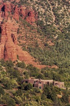 Arizona red rock canyon with buildings nestled in trees