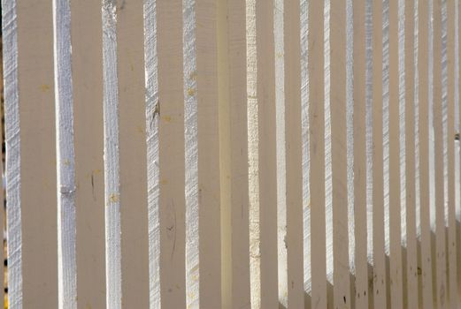 Close up of white picket fence