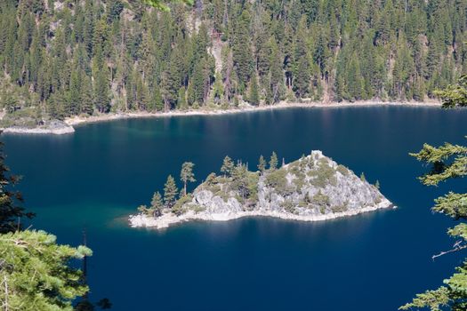 Hilly island in Lake Tahoe California surrounded by trees