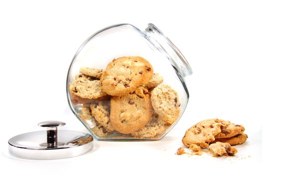 Homemade cookies in glass jar on white background
