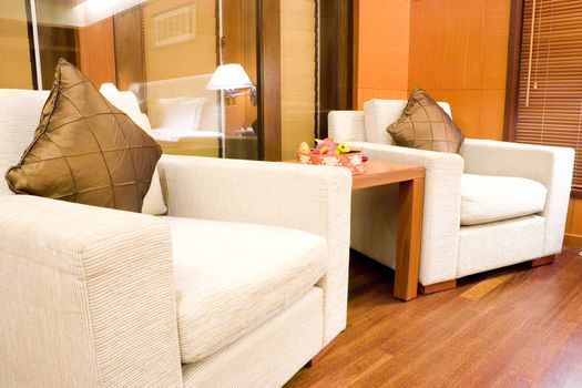 Image of a comfortable looking hotel bedroom sofas.