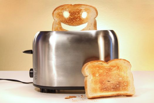 Toaster with two slices of bread on kitchen counter