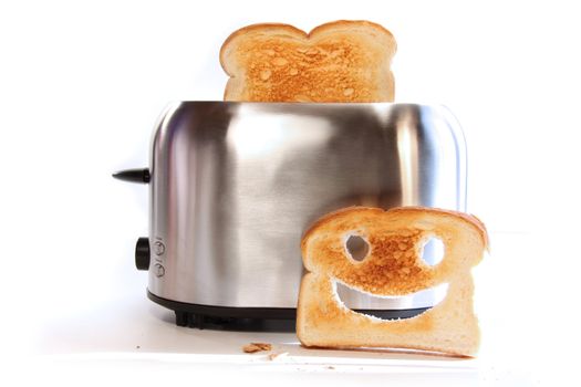 Toaster with slices of toast on a sunny lit background