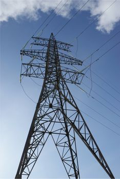 Support of an electric main. On a background of the dark blue sky