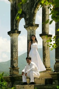 Couple in white in an old building