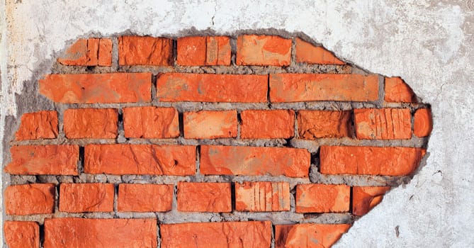 The big damage of a brick wall - an industrial urbanistic background